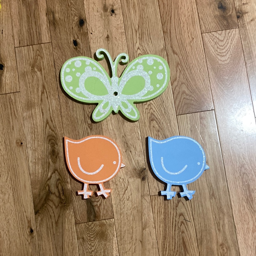 Three wooden wall decorations